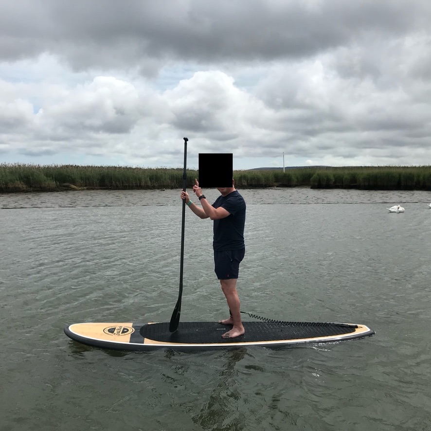 Paddleboarding on the water in Dorset